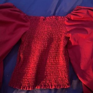 maroon colored shirt